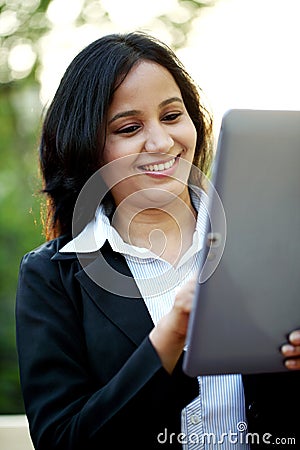 Business woman with tablet computer at outdoors