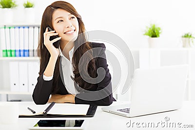 Business woman talking on the phone in office