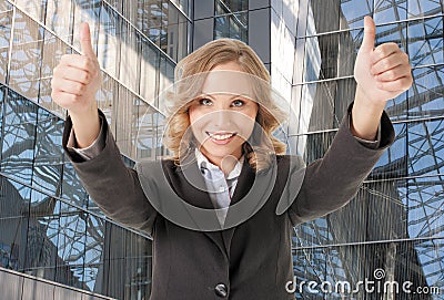 Business woman thumbs up smiling