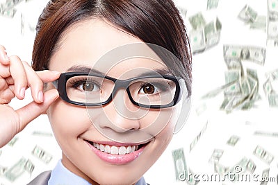 Business woman touch eye glasses with money rain