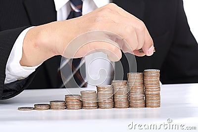 Business women put coin stack money