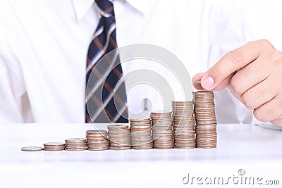 Business women put coin stack money