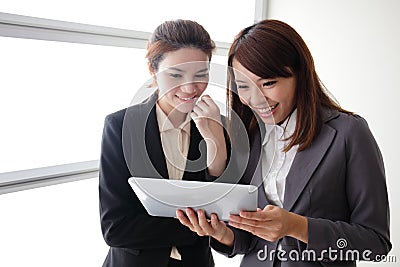 Business women smile conversation