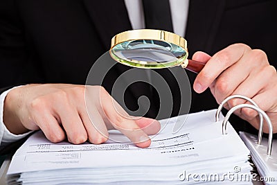 Businessman analyzing document