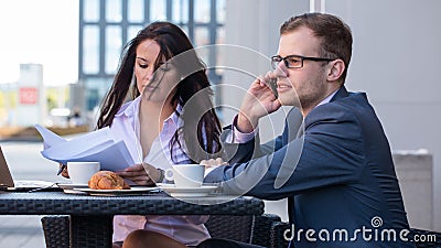 Businessman and businesswomen having a meeting in cafe.