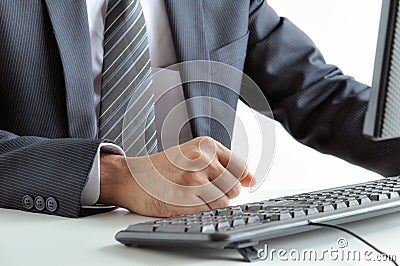 Businessman clenching his fist on working table
