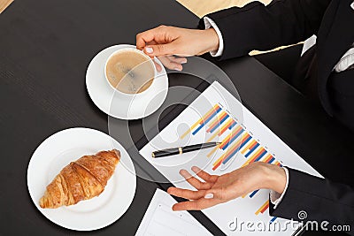 Businessman with coffee during explanation