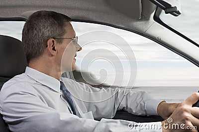 Businessman driving a car