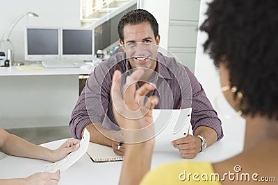 Businessman With Female Colleagues In Meeting