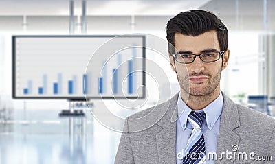 Businessman with financial graph on TV