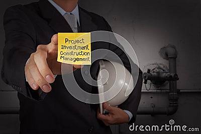 Businessman hand show project management words on sticky note wi