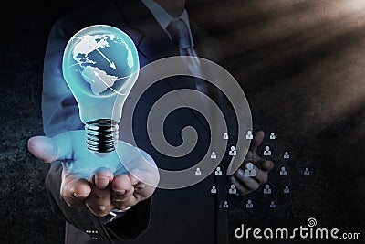 Businessman hand shows Light bulb with planet Earth social netwo