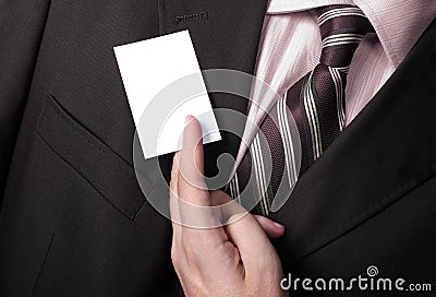 Businessman handing a blank business card