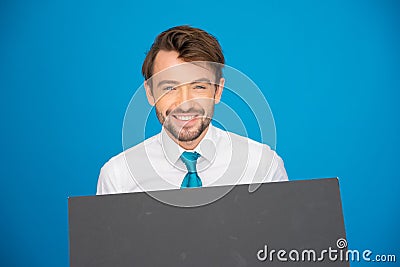 Businessman holding blank poster