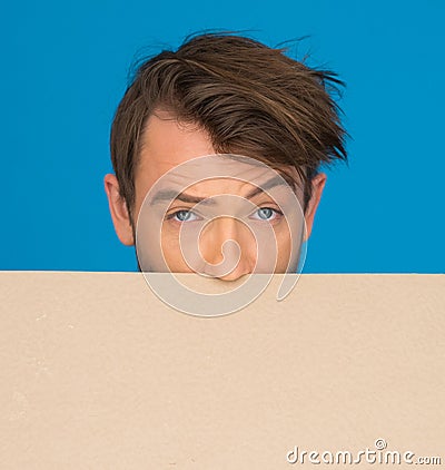 Businessman holding blank poster