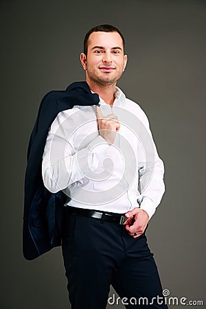 Businessman holding his jacket over shoulder