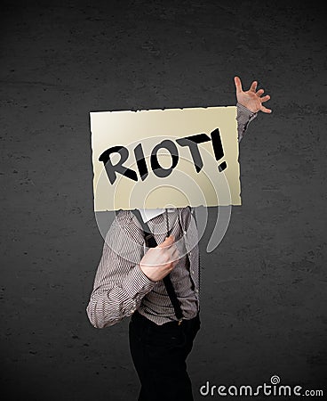 Businessman holding a protest sign