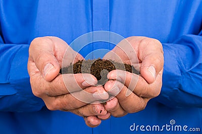 Businessman Holding Soil