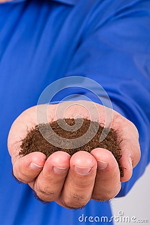 Businessman Holding Soil