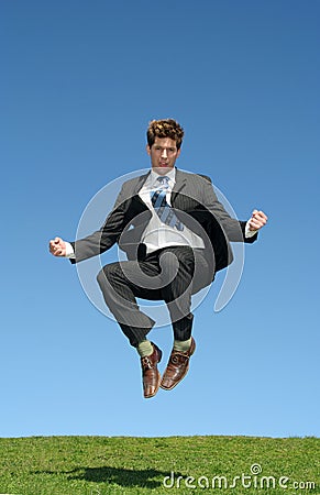 Businessman jumping for joy