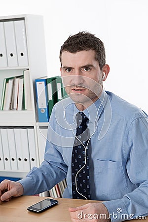 Businessman listening music