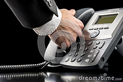 Businessman making a call on a landline