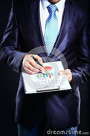 Businessman monitoring stock market