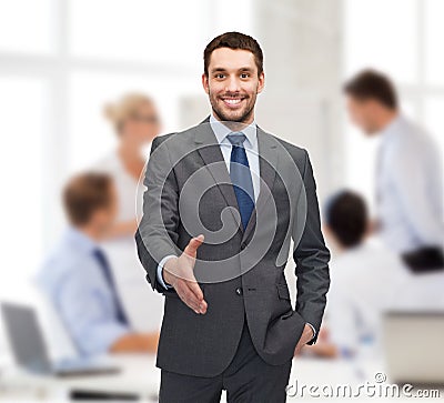 Businessman with open hand ready for handshake