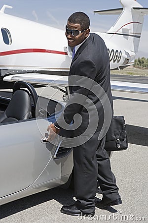 Businessman Opening The Door Of Car