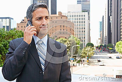 Businessman Outside Office On Mobile Phone