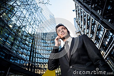 Businessman on phone office building