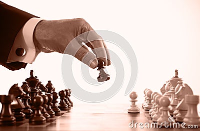 Businessman playing chess game sepia tone