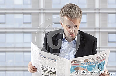 Businessman reading a newspaper