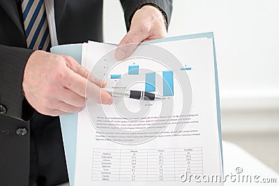 Businessman showing graphs