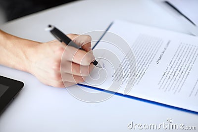 Businessman signing document