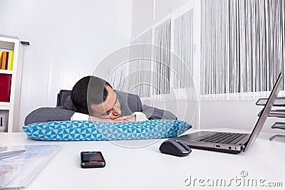 Businessman sleeping at the office