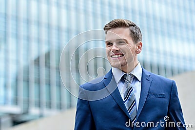 Businessman standing outside modern building