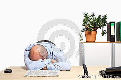 Businessman takes a nap in his office