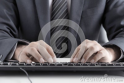 Businessman typing computer keyboard