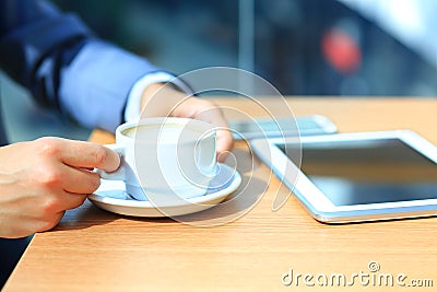 Businessman using digital tablet computer with modern mobile phone