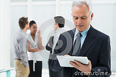 Businessman Working On Digital Tablet