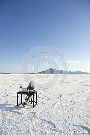 Businessman Working on Inspiration at Desk Outdoors