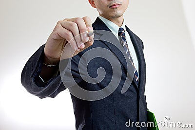 Businessman writing growing graph