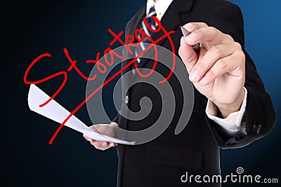 Businessman writing Strategy