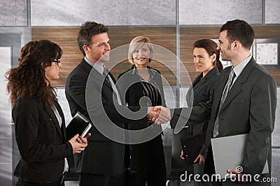 Businesspeople greeting each other