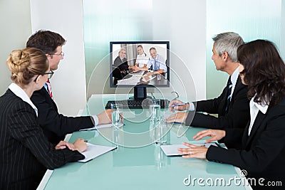 Businesspeople watching an online presentation