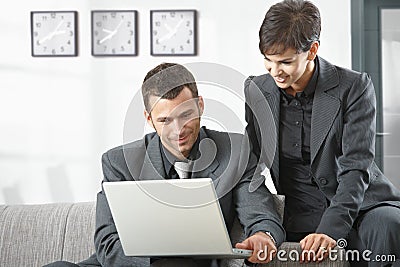 Businesspeople working on computer