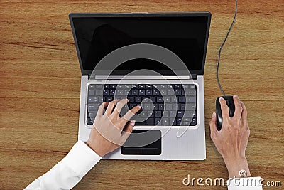 Businessperson hands working with laptop