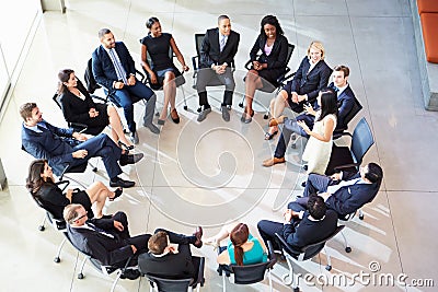 Businesswoman Addressing Multi-Cultural Office Staff Meeting