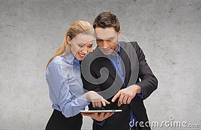 Businesswoman and businessman with tablet pc